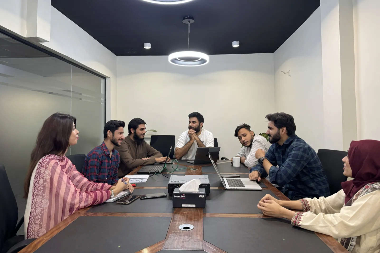 The Extend Commerce team around a meeting table